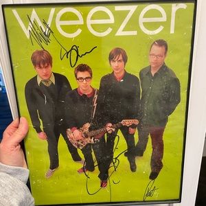 Signed Weezer poster. There are a lot of little scuff marks on the poster